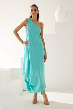 Turquoise one shoulder asymmetric dress in a draped solid base. - Aza Fashions Pre-draped One Shoulder Maxi Dress For Summer, Summer Pre-draped One Shoulder Maxi Dress, One-shoulder Pre-draped Maxi Dress For Summer, Summer One Shoulder Pre-draped Maxi Dress, Pre-draped One Shoulder Dress For Summer, One Shoulder Drape Dress, Asymmetric Dress, Draped Dress, Asymmetrical Dress