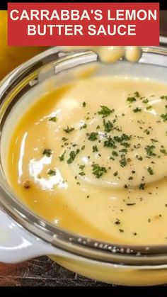 a close up of a bowl of soup with a spoon in it and the words caraba's lemon butter sauce