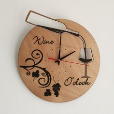 a clock with wine glasses on it and the words wine oclock written in black