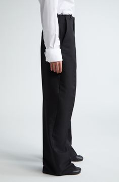 A frayed waist brings the label's modern energy to baggy pants structured with clean creases. 32 1/2" inseam; 18" leg opening; 13 1/2" front rise; 16" back rise (size 36IT) Zip fly with hook-and-bar closure Front slant pockets; back welt pockets 100% polyester Dry clean Made in Italy Designer Clothing Business Wide Leg Full-length Pants With Pockets, Business Wide Leg Full Length Pants With Pockets, Full Length Wide Leg Pants With Pockets For Business, Wide Leg Formal Pants With Pockets, Black Straight Leg Bottoms With Pressed Crease, Wide Leg Pants With Pockets For Formal Occasions, Classic Pants With Loosely Fitted Hips And Straight Hem, Formal Wide Leg Pants With Pockets And Relaxed Fit, Black Relaxed Fit Dress Pants For Formal Occasions