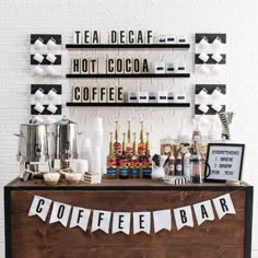 a coffee bar is decorated with black and white decorations