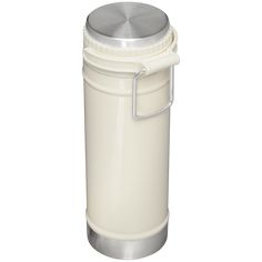 a white container with a metal lid and handle on the top is shown in front of a white background