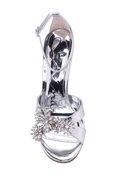 Crystal flowers and a mirror-shine finish kick up light in a sandal that's ready for wherever the night takes you. 4" heel Adjustable ankle strap with buckle closure; hidden elastic inset Synthetic upper and lining/leather sole Imported Silver Sandals For Evening And Holiday, Holiday Gala Sandals With Ankle Strap, Holiday Evening Ankle Strap Sandals, Holiday Ankle Strap Sandals For Events, Holiday Event Sandals With Ankle Strap, Holiday Heels With Ankle And Heel Straps, Silver Sandals For Spring Events, Crystal Flowers, Rollerball Perfume