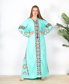 "This bohemian embroidery dress is a an eye catcher! It is an extremely comfortable wear, light and soft and can be used on many occasions - home gatherings, festival parties, summer occasions, dinners, or just in your home to feel comfortable. Fabric: 80% Egyptian Cotton; 20% Polyester. Size: one size Length : 59 inches For your reference, the model is 5'4\" and a size Small 4 on the US scale. She is wearing a size XL in this dress and that's why it's pretty loose on her. >> Shipping times<< We ship all orders with DHL or UPS Express within one to two business days. Delivery times to the USA and Europe are 3 to 5 days from the date of shipping. On average, you should receive your order within 4 to 7 days from the day you place the order. >> Refunds, returns, and exchanges<< We provide ful Bohemian Maxi Length Green Abaya, Bohemian Green V-neck Abaya, Bohemian Embroidered Abaya For Spring, Green Bohemian Embroidered Maxi Dress, Green Bohemian Abaya With V-neck, Bohemian Abaya With Embroidered Border For Eid, Bohemian Embroidered V-neck Abaya, Green Bohemian Embroidered Dress For Eid, Green Bohemian Kaftan With Intricate Embroidery