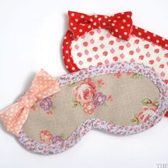 three pieces of fabric with bows and polka dots on them, one in the shape of a sleeping mask