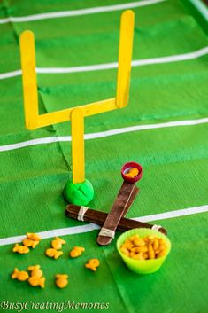 a football field made out of paper and some snacks