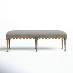 the bench is made out of wood and has an upholstered cushion on it