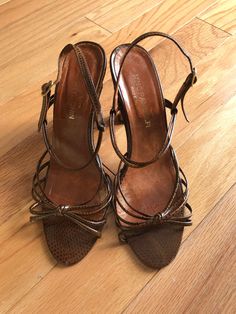 "Description  * Brown leather Animal print sandals by Nino Pandolfi * Leather sole * Made in Italy Material All leather except insole Condition Excellent vintage condition.  Heel taps need to be replaced however due to age (see photo). Size 8 Measurements Insole: 9.75\"/24.7 cm Heel height: 3.75\"/9.5 cm  Label History No information available   On Instagram? Follow me for updates on the latest vintage additions https://www.instagram.com/smokeypearlvintage/ All vintage garments will show general signs of wear consistent with its age and use." Brown T-strap Heels For Party, Brown Round Toe Sandals For Party, Brown Heels With Adjustable Ankle Strap, Brown Adjustable Ankle Strap Heels, Adjustable Brown Ankle Strap Heels, Adjustable Open Heel Brown Heels, Brown Adjustable Open Heel Shoes, Adjustable Brown Open Heel Shoes, Brown Sandals With Penny Strap And Open Heel