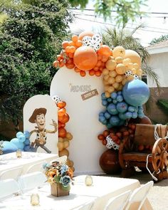 an outdoor event with balloons and decorations