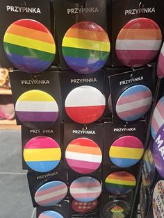 many different colored buttons on display in a store