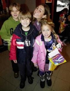 a group of young children standing next to each other