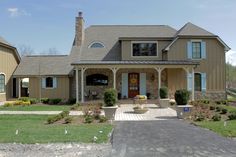 a large house with two garages in the front yard