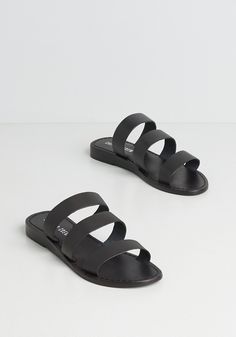 Slip on these black leather sandals for an instant kickstart to a happy day. From Chelsea Crew, this pair of minimally chic sandals feature a strappy, open-toe upper with a leather-lined cushioned footbed atop a subtle wedge sole - both offering comfy, all-day long wear. Happiness is easy to come by, and is even easier when you’re wearing these sliide sandals from city streets to a sandy, island beach. Leather upper and lining. Man-made sole. Imported Chelsea Crew brand shoe size 36 corresponds Vintage Style Swimwear, Modcloth Shoes, T Strap Shoes, Flat Heel Boots, Chic Sandals, Vintage Swimwear, Black Leather Sandals, Casual Rompers, Unique Shoes