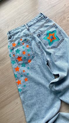 Jeans painting Painted Overalls Aesthetic, Jean Painting Ideas Easy, Senior Hoco Jeans Ideas, Paint On Jeans Ideas, Custom Jeans Diy Paint, Hoco Jeans Painted Ideas, Painting Ideas On Jeans, Senior Jeans Painted 2025, Painting Jeans Ideas