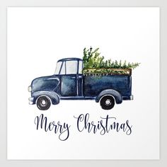 a blue truck with a christmas tree in the back and merry christmas written on it