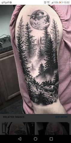 a man's arm with a forest scene on it and the moon in the sky