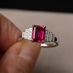 This is a gorgeous handmade creation. Its beauty is its simplicity & Elegance. The 6*8mm emerald shape faceted lab ruby is crafted in solid sterling silver and with rhodium plated. All item is sent in a beautiful gift box If you have any idea of design your ring,pls contact me directly. You can realize more lovely stuff clicking the link https://www.etsy.com/shop/knightjewelry?refshopsection_shophome_leftnav Please leave the correct address and you phone number for delivering successfully. Lowkey Wedding, Emerald Cut Ring, July Birthstone Ring, Green Sapphire Ring, Ring Emerald Cut, Red Rings, Emerald Cut Rings, Ring Emerald, Birthday Ring