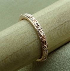 "This wedding band is made of 14k natural rose gold. The Band is hand engraved and high polished. This art deco style band is 2.2 mm wide, 1.7 mm tall and available in all finger sizes. This band is available in either 14K yellow, white or pink gold. We can make it any size from 4 to 6 and you still be able to return it within the listed time frame. Sizing outside of that range requires a resize fee if for any reason the ring is retuned. Ring sizing may add additional handling time. We love this Engraved Wedding Band, Gold Wedding Bands Women, Antique Style Rings, Wedding Band Engraving, Flower Style, Engraved Wedding, Blue Sapphire Diamond, Circle Diamond, Pink Morganite