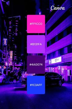 a car parked on the side of a street in front of tall buildings at night