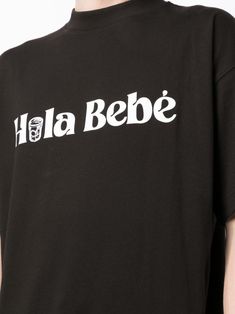 Hola Bebé organic-cotton T-shirt from BLUE SKY INN featuring black, organic cotton, slogan print to the front, round neck, short sleeves and straight hem. This item is made from at least 50% organic materials.. Learn more about what makes a product Conscious on our Conscious Criteria page. Size Info STANDARD Color Detail Black Made In Italy Material 100% Cotton Season One Fall-Winter Season Two Fall-Winter Product t-shirts and polos Brand Blue Sky Inn Size And Fit This piece fits true to size. W Black Organic Cotton T-shirt For Streetwear, Organic Cotton Short Sleeve T-shirt With Letter Print, Basic Organic Cotton T-shirt With Graphic Print, Black Organic Cotton Streetwear T-shirt, Organic Cotton Screen Print T-shirt For Streetwear, Organic Cotton Graphic T-shirt For Streetwear, Organic Cotton Short Sleeve T-shirt With Logo, Organic Cotton Graphic Tee For Streetwear, Organic Cotton Logo Print T-shirt With Short Sleeves