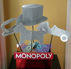 there is a monopoly box with money and a top hat on it that says monopoly