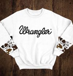 Country Sweatshirt Ideas, Wrangler Cow Print Sweatshirt, Cow Print Clothes Aesthetic, Things You Need For A Horse, Cow Print Shirt Ideas, Country Sweatshirts & Hoodies, Western Workout Clothes, Cute Western Clothes For Women, Western Crewneck Outfit