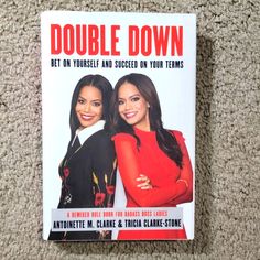 two women standing next to each other in front of a sign that says double down