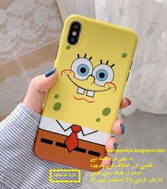 a person holding up a phone case with a cartoon character on it