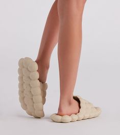 Treat your feet to a low-key massage and walks on a cloud in these foam bubble slides featuring a round toe. wide strap. and comfortable textured foam insoles. Style with a cozy casual jacket for running errands!Fit & Features Round toe Wide strap Comfort textured foam insole Bubble design Runs true to size Comfortable Beige Slides With Textured Footbed, Casual Beige Slides With Textured Sole, Casual Foam Slippers With Textured Footbed, Bubble Slides, Bubble Design, Wide Straps, Low Key, Casual Jacket, Walk On