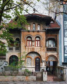 an old building with many windows and balconies