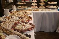 a table filled with lots of different types of pastries