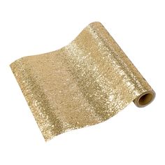 a roll of gold sequinized paper on a white background