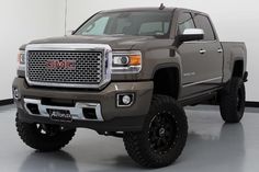 a large gray truck parked in a garage