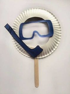 a paper plate with a mask and snorkel on it