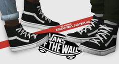 two people standing on top of black and white shoes with red tape around them that says vans of the wall