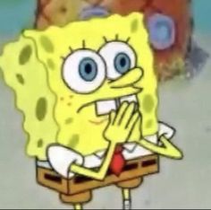 an animated spongebob holding his hands up to his mouth