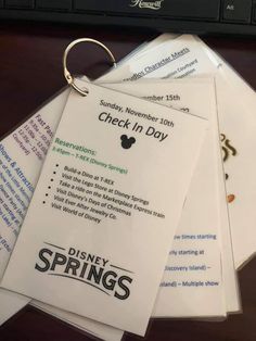 the disneyland springs check in day has been placed on top of each other for guests to sign up