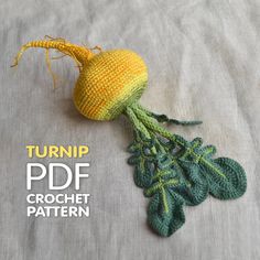 a crocheted yellow flower with green leaves on the side and text that reads turnip pdf crochet pattern