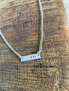 Gorgeous 25mm hand stamped plaque mounted on silver plated necklace. Please pop in notes or drop me a message with your Angel numbers!x Silver Stamped Charm Necklace For Birthday, Silver Hand Stamped Necklace For Birthday Gift, Silver Stamped Necklace For Birthday, Silver Hand Stamped Nameplate Necklace, Silver Laser Engraved Charm Necklaces For Anniversary, Silver Laser Engraved Charm Necklace For Anniversary, Silver Stamped Nameplate Necklace, Silver Dog Tag Necklace With Name, Angel Numbers 111