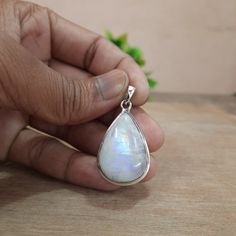 This Moonstone Silver Pendant with a dainty chain is an absolute stunner. The enchanting moonstone glimmers with a mystical allure, while the silver setting adds a touch of sophistication. It's the perfect accessory to add a touch of magic to any outfit! ✨🌙 Makes a Wonderful Gift for your Girlfriend, Wife, Mom or Simply an Excellent Addition to Your Jewelry Collection. Comes in a FREE GIFT BOX ●Product Details:- *Product Type - Pendant Necklace *Metal              - Sterling Silver *Stamp             - 925 *Gemstone      - Moonstone *Gemstone Color - Blue *Gemstone Cut - Cabochon  *Gemstone Treatment- Natural (No Treatment) *Gemstone Shape- Pear *Product Weight - 8.60gm Approximate  ●Quality:- >>Each piece is crafted by hand, ensuring that it is made with care and attention to detail. The White Mystical Pendant Jewelry, Mystical White Pendant Jewelry, White Moon-shaped Jewelry With Natural Stones, White Moon-shaped Natural Stone Jewelry, White Moon-shaped Gemstone Jewelry, White Moonstone Gemstones With Spiritual Style, Spiritual Moonstone Pendant Gemstone, Spiritual White Moonstone Gemstones, White Moonstone Gemstones As Gift