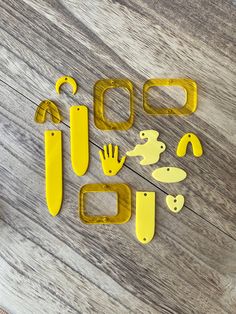 some yellow objects are laying on the floor next to each other and one is cut out