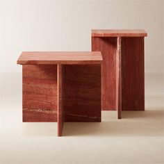 two wooden tables sitting next to each other