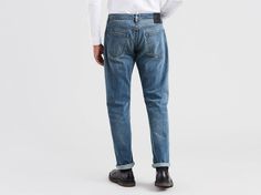 A classic taper for every day. The 502™ Taper Fit Jean offers a slim fit in the seat and thigh, and a slightly tapered cut for a modern casual look. Reinterpreted in premium Italian selvedge stretch denim for our Made & Crafted® collection. Style # 565180009Color: Murphy - Dark Wash How it Fits Sits at waistRegular fit through thighSlightly tapered leg opening: 14.5"Measurements based on size 32 Composition & Care 98% Cotton, 2% ElastaneStretch DenimZip Fly5-pocket stylingWash And Dry Inside Out Classic Taper, Fit In, Tapered Legs, Jeans Fit, Stretch Denim, Casual Looks, Levi Jeans, Mens Jeans, Levi's