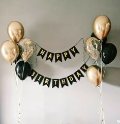 black and gold balloons with happy birthday banner