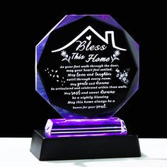 a purple glass award with a poem on it