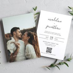 an image of a wedding card with greenery