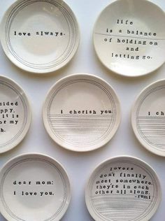 six plates with words written on them sitting next to each other in front of a white background