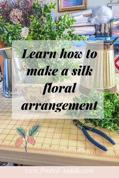 a cutting board with scissors and plants on it that says learn how to make a silk floral arrangement