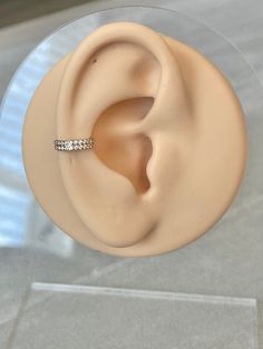 a fake ear with a ring on top of it