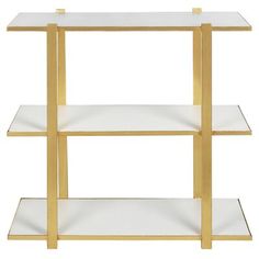 three tiered shelving unit in gold and white with glass shelves on each side